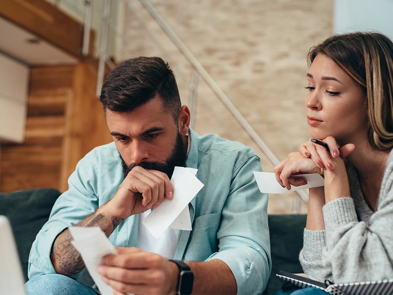 Young couple reviewing monthly budget