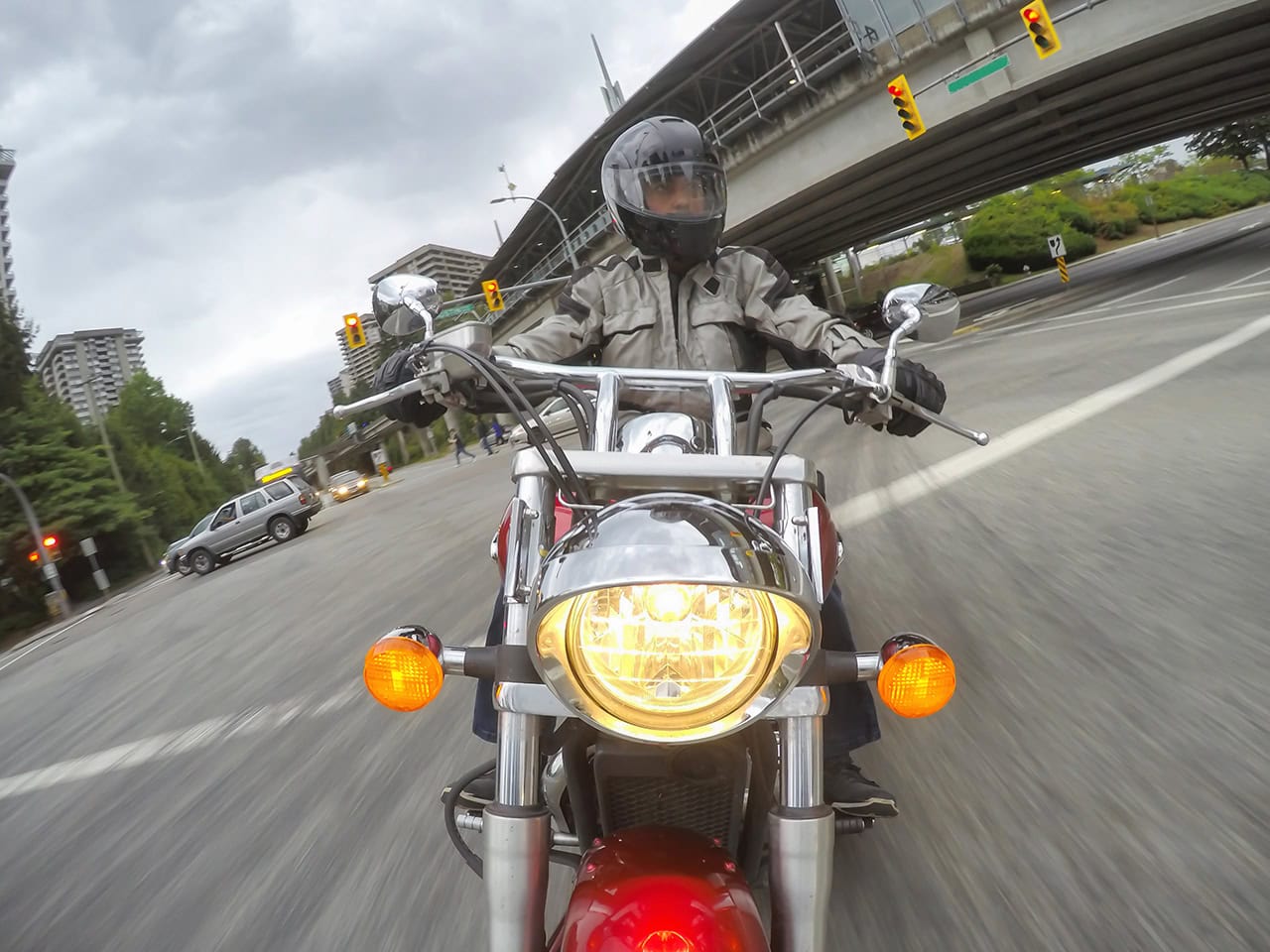 Man riding motorcycle on busy street