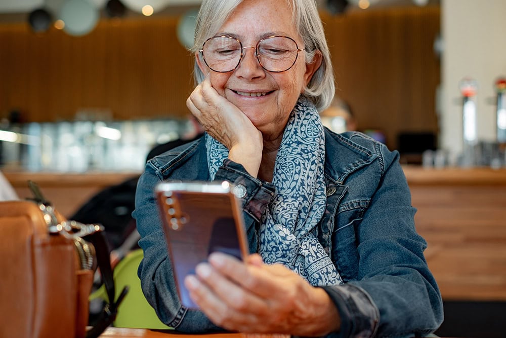 senior woman sending a text message