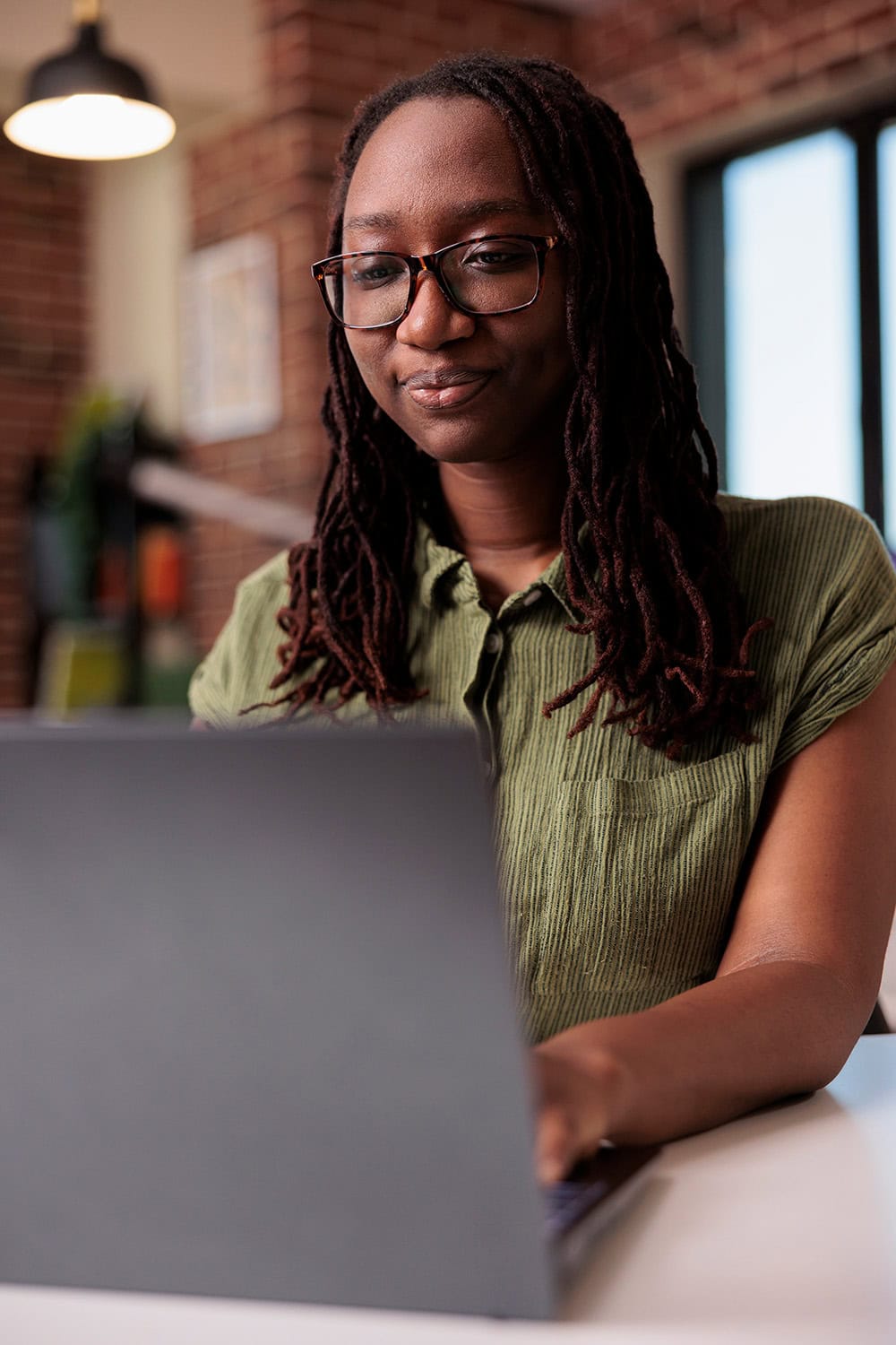 younger woman on laptop