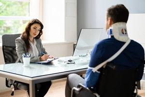 injured worker talking to a lawyer