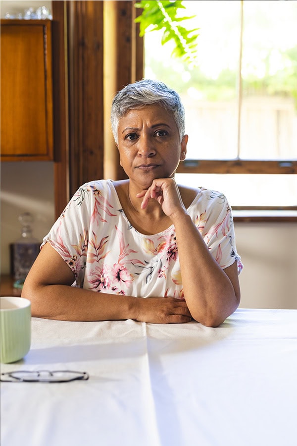 middle aged woman at a table