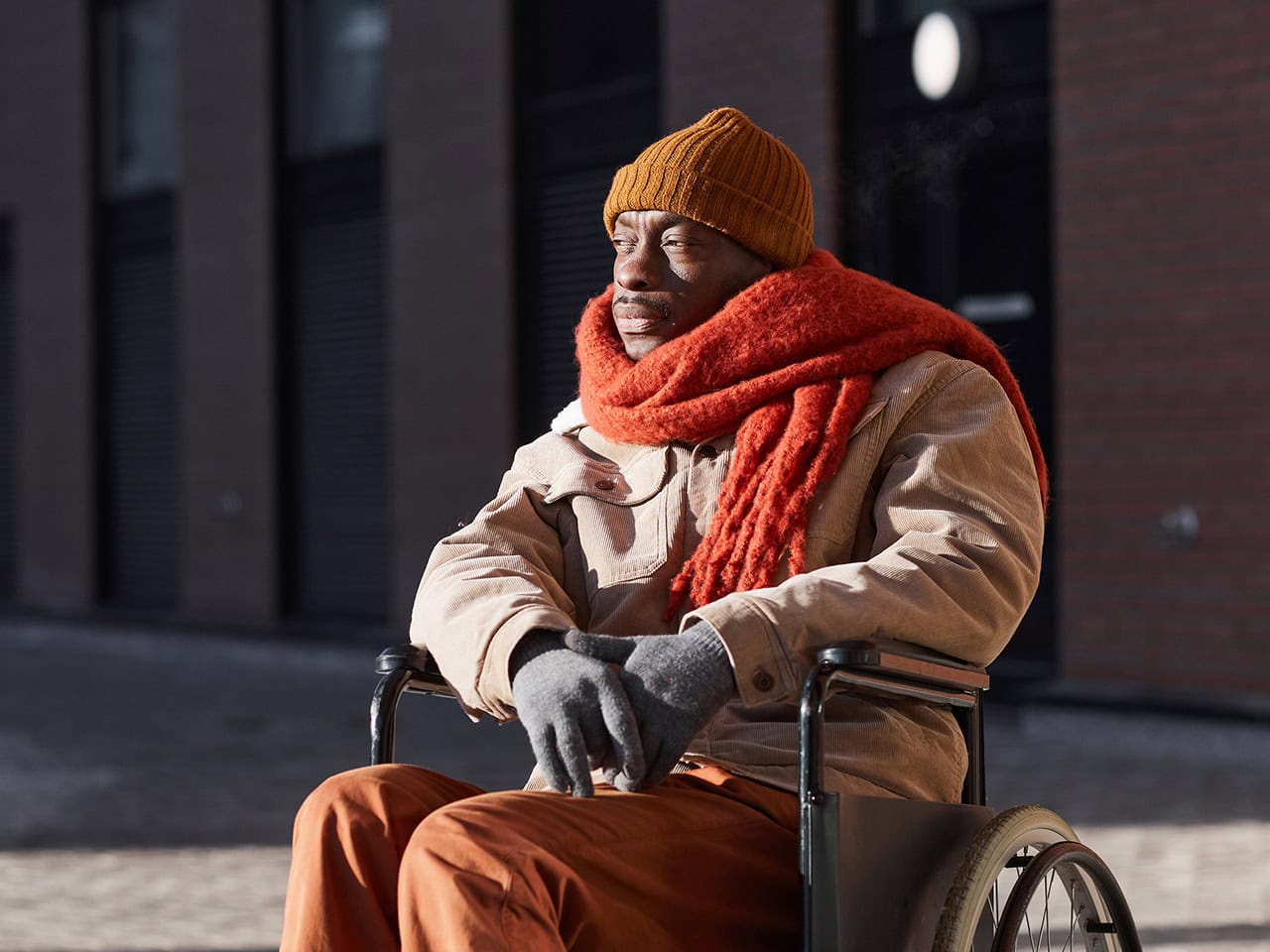 Disabled man with scarf and gloves