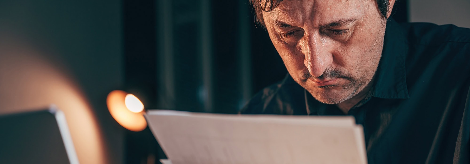 Middle aged man reviewing bills