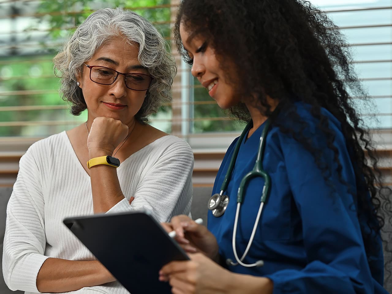 Healthy senior woman getting a physical exam
