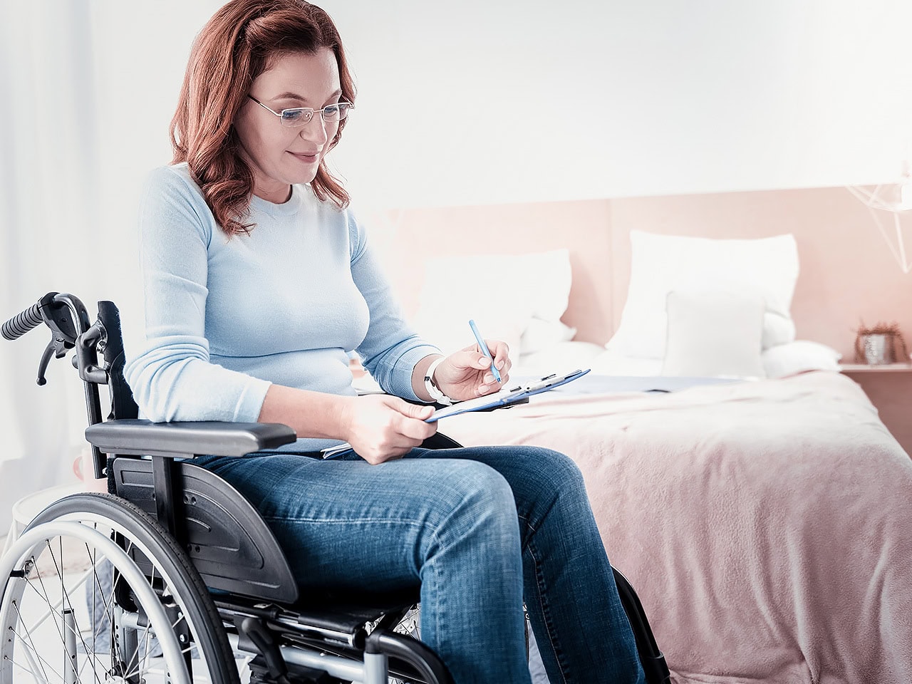 Disabled woman filling paperwork