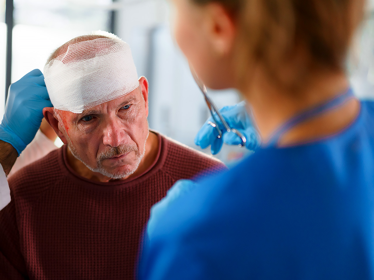 Worker with head bandage