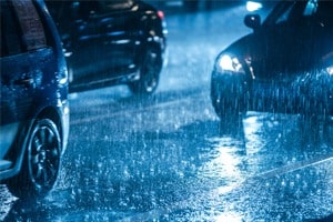 cars driving in the rain