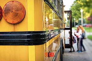 students boarding a school bus