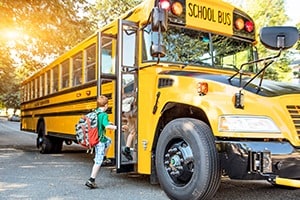 child-getting-on-school-bus