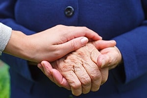 elderly-person-holding-hands
