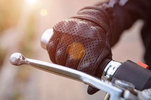 motorcycle-rider-hand-on-handlebar